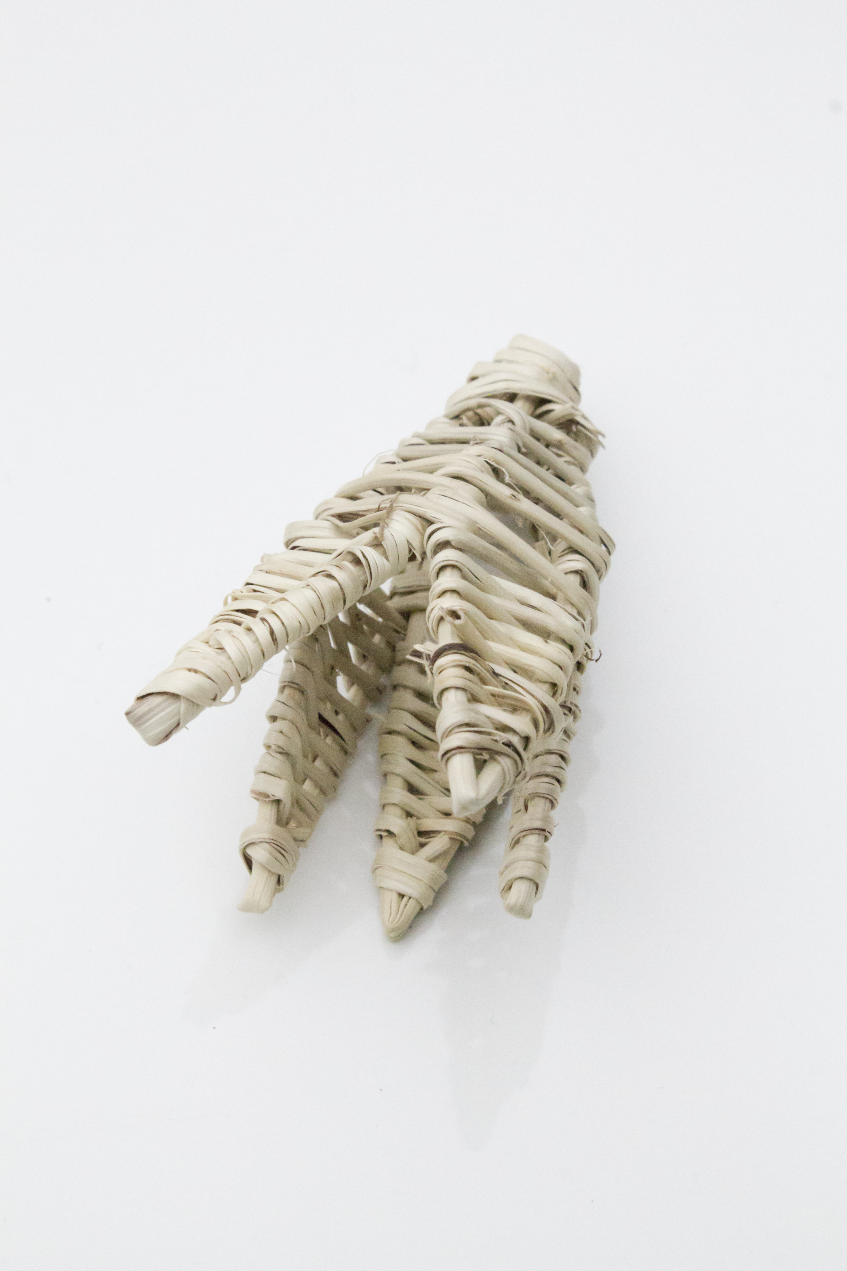 Decorative item resembling a lily on a white background