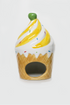 Ceramic ice cream cone-shaped container with yellow swirl and green top on a white background