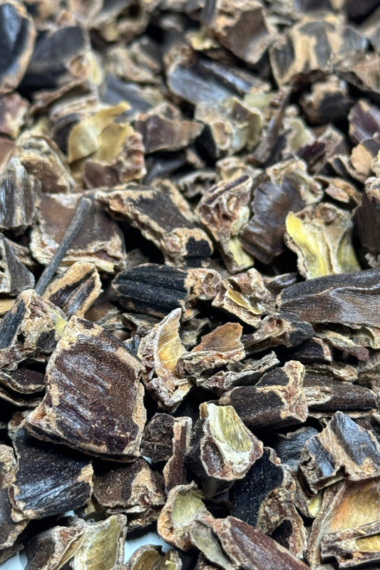 Close-up image of dried carob pieces, a healthy treat for hamsters and gerbils.