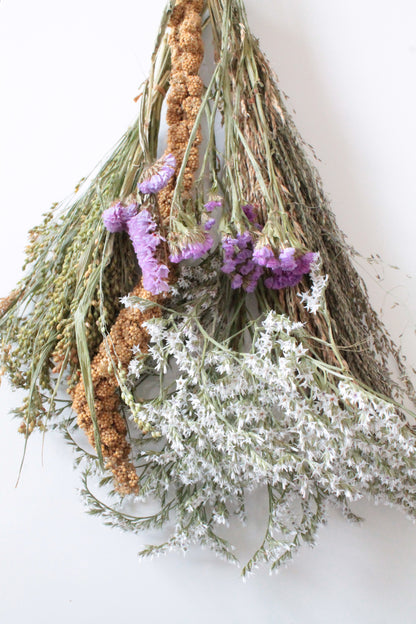 Bouquet of dried sprays and other herbs on a white background