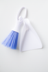 White dustpan with blue bristle brush on a white background